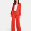 Wide trousers with vertical pintucks