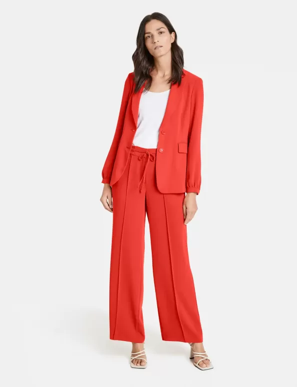Wide trousers with vertical pintucks