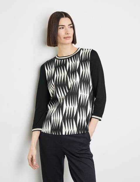 Blouse top with 3/4-length sleeves and fabric panelling