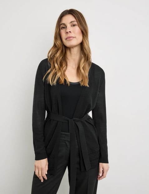 Open cardigan with crocheted details and a tie-around belt