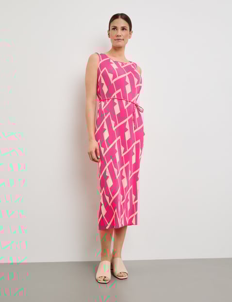 Patterned pleated dress with a waistband