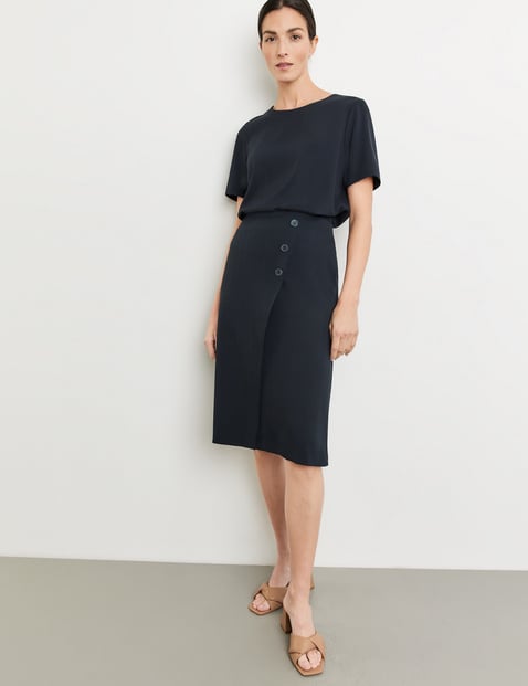 Knee-length skirt with a wrap effect