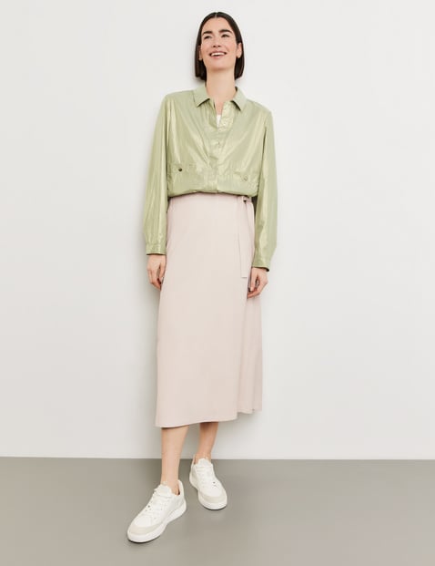 Wrap-over skirt with a patch pocket