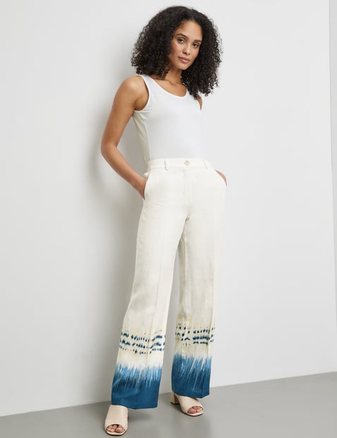 Linen trousers with a patterned hem