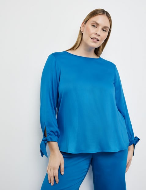 Blouse top with knotted details on the sleeves