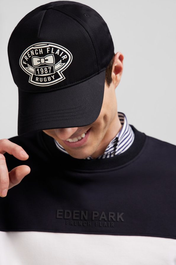 cap with ecru embroidery